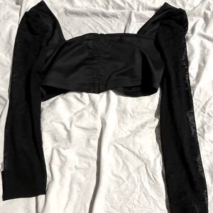 Cropped black top with sheer cheetah print sleeves